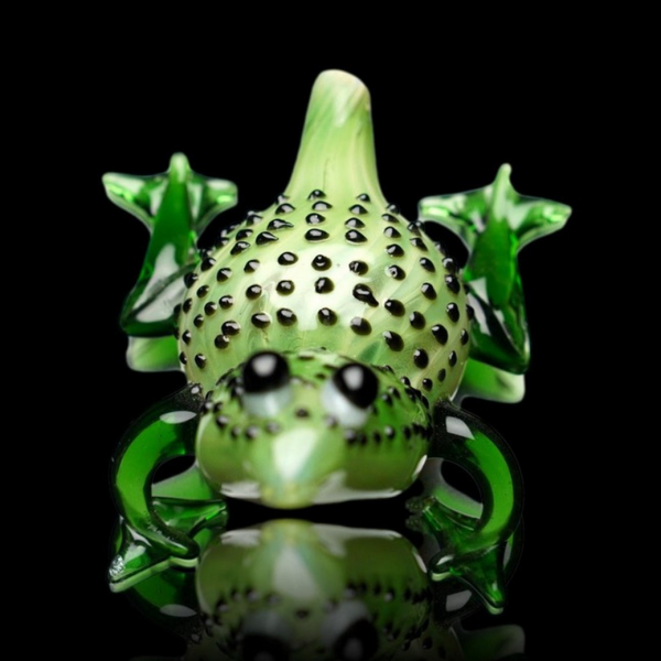 5" Frog Glass Hand Pipe, where whimsical design meets exceptional functionality. Crafted with precision and care, this hand pipe is not just a smoking accessory but a work of art.