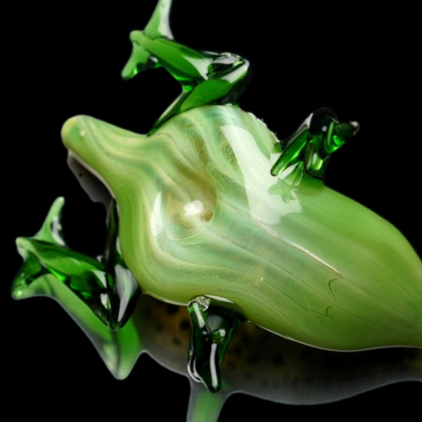 5" Frog Glass Hand Pipe, where whimsical design meets exceptional functionality. Crafted with precision and care, this hand pipe is not just a smoking accessory but a work of art.