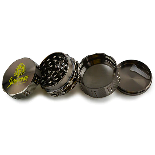 Shredder - Grinder (2")(52mm) Revolutionize your herb grinding routine with the Shredder - Grinder. This 4-piece powerhouse, featuring a robust Heavy Duty build and a versatile 52mm size, is designed to bring precision and style to your herb preparation ritual.