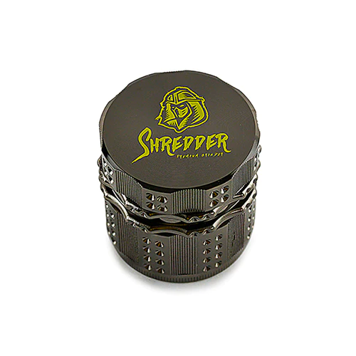 Shredder - Grinder (2")(52mm) Revolutionize your herb grinding routine with the Shredder - Grinder. This 4-piece powerhouse, featuring a robust Heavy Duty build and a versatile 52mm size, is designed to bring precision and style to your herb preparation ritual.