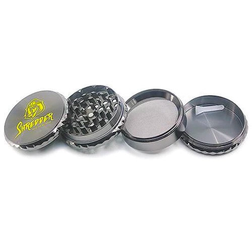 Shredder - Diamond Cut Drum Grinder (2.5")(63mm) Elevate your herb grinding experience with the Shredder - Diamond Cut Drum Grinder. This 4-piece marvel features a Heavy Duty build, a spacious 63mm size, and a diamond-cut drum design that adds a touch of sophistication to your herb preparation ritual.