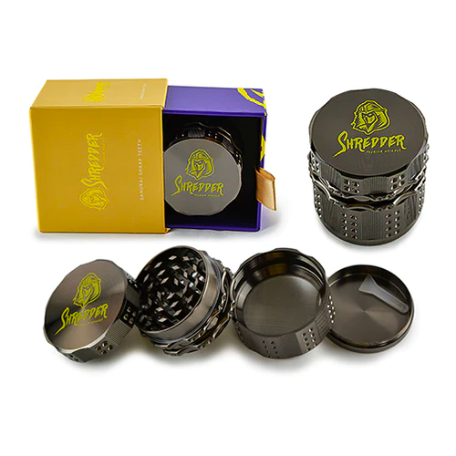 Shredder - Grinder (2")(55mm) Take your herb grinding experience to the next level with the Shredder - Grinder. This 4-piece marvel, featuring a robust Heavy Duty build and a versatile 55mm size, is meticulously crafted to redefine precision and style in herb preparation.