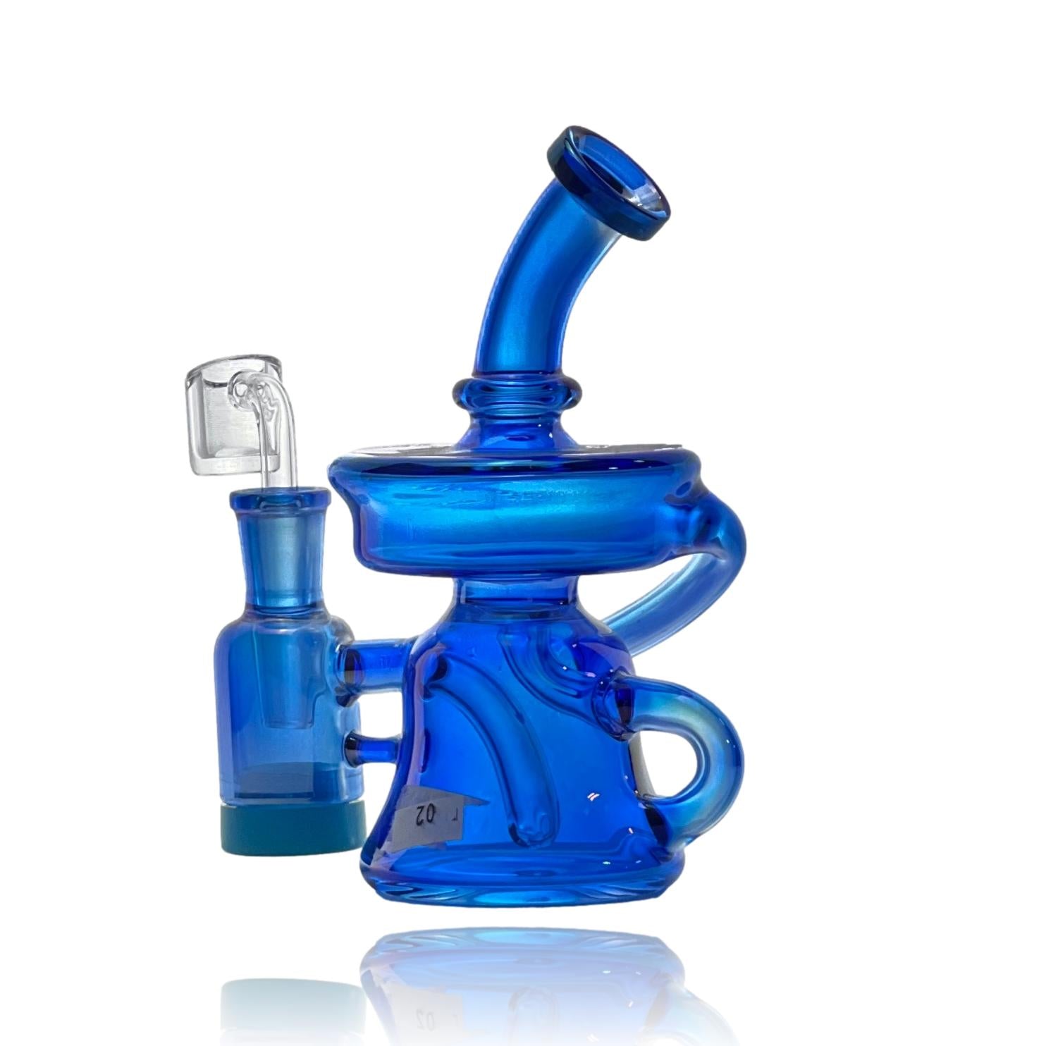 Crystal Glass combined the reclaim catcher, which would normally be a separate attachment to help keep the rig clean while saving left over resin, and a beautiful recycler. The function is amazing and the flavor is unmatched. Enjoy the iridescent colors while vaping your favorite concentrate and watch how quickly this becomes your favorite piece.