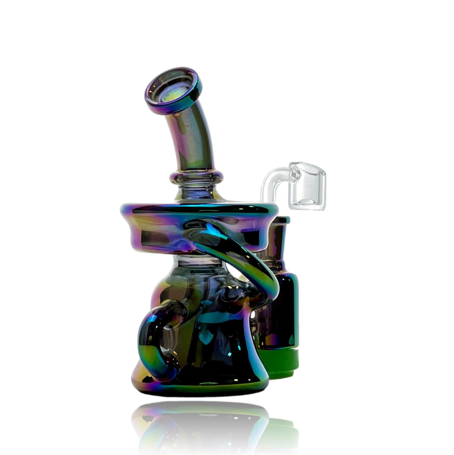 Introducing the Mini Metallic Recycler Dab Rig – Compact Brilliance, Maximum Performance  Unleash the power of concentrated sophistication with our Mini Metallic Recycler Dab Rig, a pocket-sized wonder engineered to redefine the art of dabbing. Crafted with precision and sleek metallic accents, this mini rig boasts maximum efficiency and style for on-the-go enthusiasts who demand the best from their concentrate experie