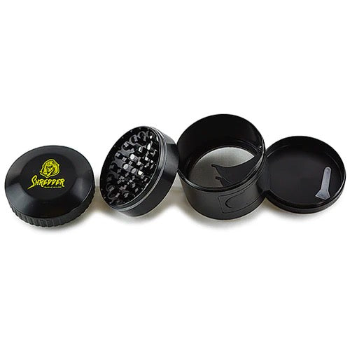 Shredder - Stealth Side Open Grinder (2.5")(63mm) Unleash the art of discreet grinding with the Shredder - Stealth Side Open Grinder. This 4-piece marvel features a Heavy Duty build, a spacious 63mm size, and a side open design for a unique and convenient herb preparation ritual.