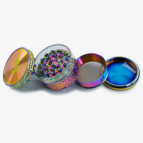 Shredder - Rainbow Window Grind Grinder (2")(50mm) Immerse yourself in a world of color and precision with the Shredder - Rainbow Window Grind Grinder. This 4-piece masterpiece features a Heavy Duty build, a compact 50mm size, and a rainbow window design that adds a vibrant touch to your herb preparation