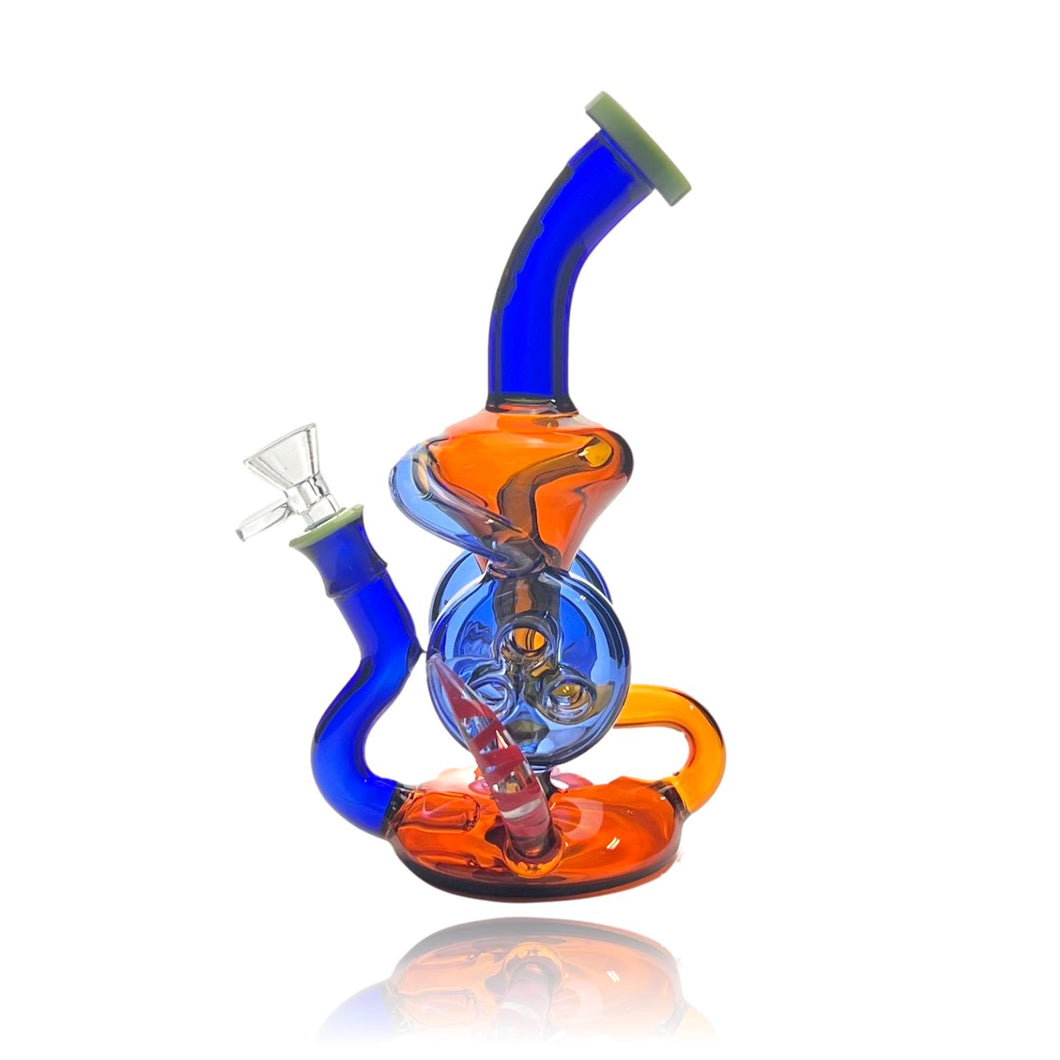 Introducing the Kandy Double Horn Recycler Rig– Elevate Your Smoking Experience with Dual Cyclonic Precision  Embark on a journey of unparalleled smoking sophistication with our Double Horn Recycler Bong. Meticulously crafted to redefine your smoking rituals, this bong features dual cyclonic horns that not only captivate the eye but also enhance the cooling and filtration process for an extraordinary, smooth draw.