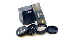 Load image into Gallery viewer, Benji GRIND - Aluminum Grinder + Booklet 4 piece 2.2 inch (55mm) Introducing the Benji GRIND – where style meets functionality. This 4-piece Aluminum Grinder comes complete with a booklet, offering you a seamless grinding experience and valuable insights into the art of herb preparation. Crafted with precision, the Benji GRIND is your key to a Heavy Duty herb grinding ritual.
