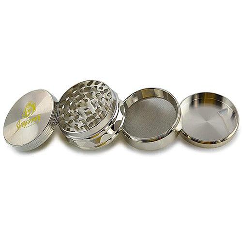 Shredder - Ridged Rim Grinder (2.5")(63mm) Grind with precision and style using the Shredder - Ridged Rim Grinder. This 4-piece marvel, featuring a robust Heavy Duty build and a spacious 63mm size with a ridged rim, adds a touch of sophistication to your herb preparation experience.