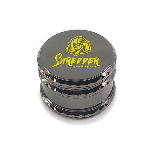 Shredder - Diamond Cut Drum Grinder (2.5")(63mm) Elevate your herb grinding experience with the Shredder - Diamond Cut Drum Grinder. This 4-piece marvel features a Heavy Duty build, a spacious 63mm size, and a diamond-cut drum design that adds a touch of sophistication to your herb preparation ritual.