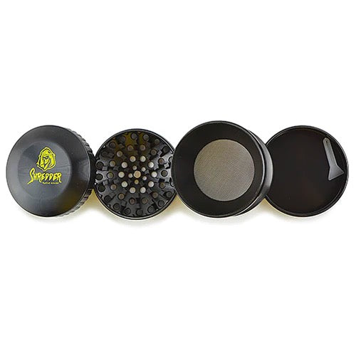 Shredder - Curvy Grinder (2.5")(63mm) Indulge in sophistication and power with the Shredder - Curvy Grinder. This 4-piece masterpiece features a Heavy Duty build, a spacious 63mm size, and a curvy design that combines style and functionality for an unparalleled herb grinding experience.